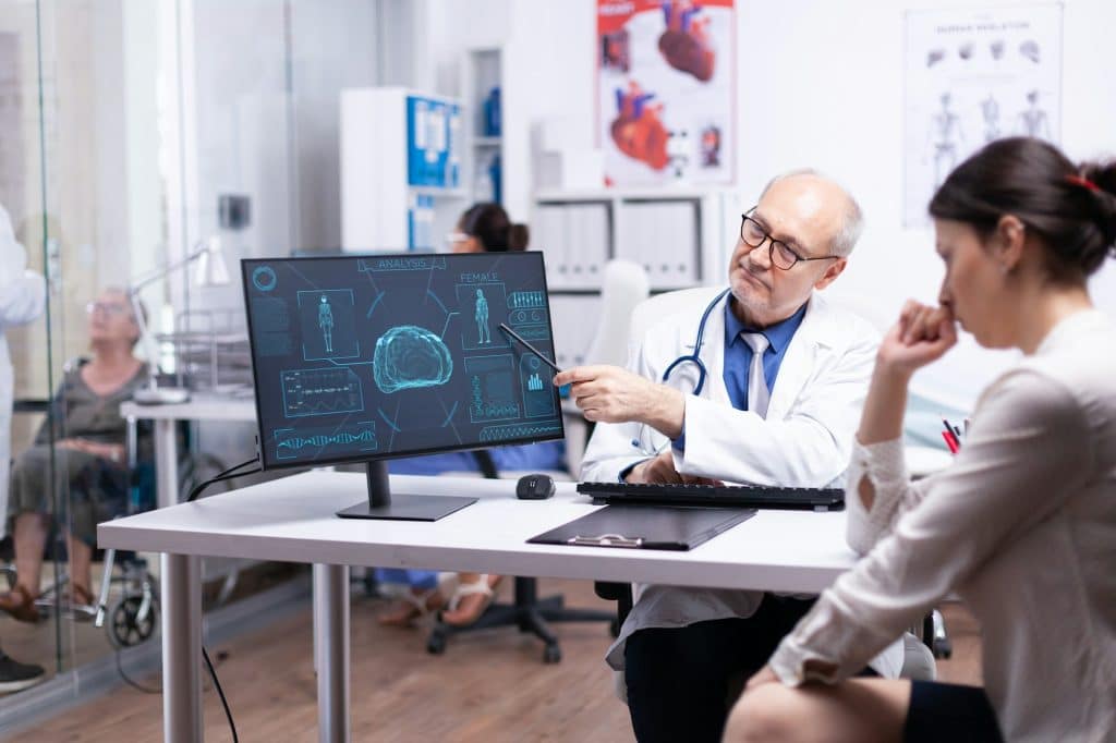 Young lady during consulation sitting in clinic room Young lady during consulation sitting in clinic room